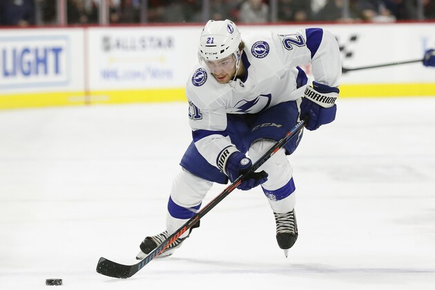 Tampa Bay Lightning center Brayden Point (21) skates against the Carolina Hurricanes during the first period of an NHL hockey game in Raleigh, N.C., Sunday, Jan. 5, 2020. (AP Photo/Gerry Broome)