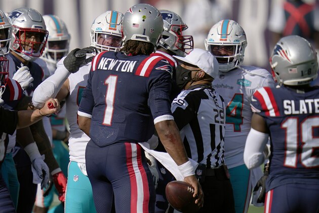 New England Patriots quarterback Cam Newton has words with Miami Dolphins players after an NFL football game, Sunday, Sept. 13, 2020, in Foxborough, Mass. (AP Photo/Charles Krupa)