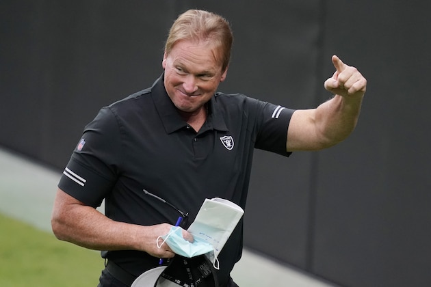 Las Vegas Raiders head coach Jon Gruden reacts during an NFL football training camp practice Friday, Aug. 21, 2020, in Las Vegas. The excitement over the move to Las Vegas has been tempered a bit by the fact no fans will be allowed at the games because of the coronavirus. Owner Mark Davis has said he won't go to games either until his fans are allowed so the real unveiling might not come until 2021.