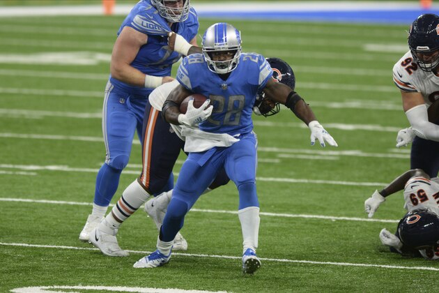 Detroit Lions running back Adrian Peterson (28) runs against the Chicago Bears in the second half of an NFL football game in Detroit, Sunday, Sept. 13, 2020. (AP Photo/Jose Juarez)