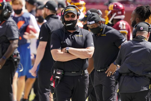 Washington Football Team head coach Ron Rivera, walking on the sidelines during the first half of an NFL football game against the Philadelphia Eagles, Sunday, Sept. 13, 2020, in Landover, Md. (AP Photo/Alex Brandon)