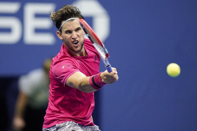 Dominic Thiem, of Austria, returns a shot to Alexander Zverev, of Germany, during the men's singles final of the US Open tennis championships, Sunday, Sept. 13, 2020, in New York. (AP Photo/Frank Franklin II)