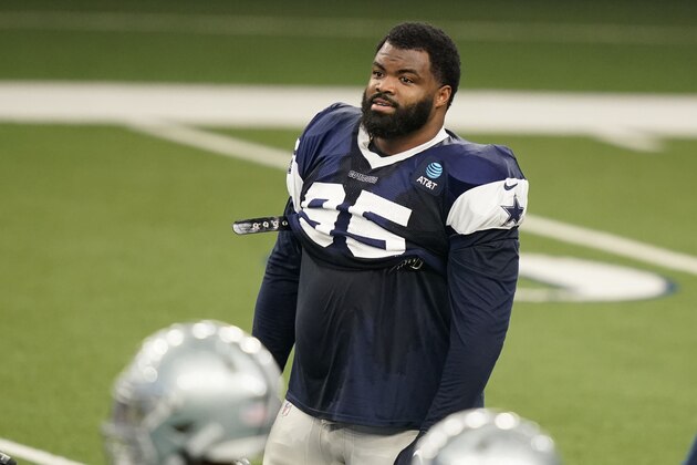 Dallas Cowboys defensive lineman Dontari Poe (95) stands on the field during an NFL football training camp in Frisco, Texas, Monday, Aug. 24, 2020. (AP Photo/LM Otero)