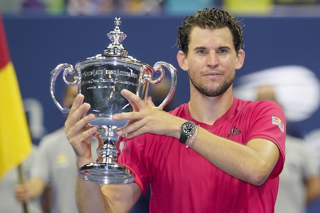 Dominic Thiem, of Austria, holds up the championship trophy after defeating Alexander Zverev, of Germany, in the men's singles final of the US Open tennis championships, Sunday, Sept. 13, 2020, in New York. (AP Photo/Frank Franklin II)