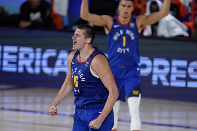 Denver Nuggets' Nikola Jokic (15) celebrates after a basket during the second half of an NBA conference semifinal playoff basketball game against the Los Angeles Clippers, Friday, Sept. 11, 2020, in Lake Buena Vista, Fla. (AP Photo/Mark J. Terrill)