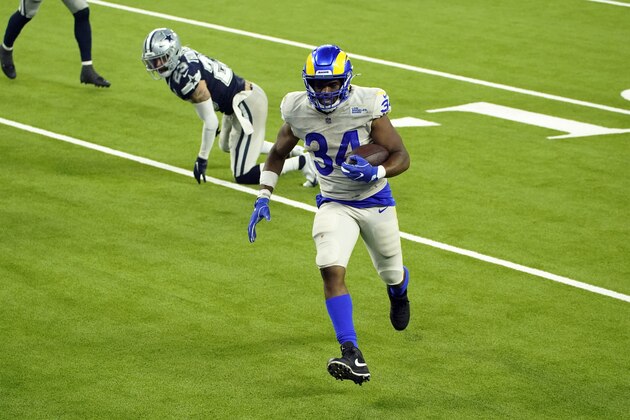 Los Angeles Rams running back Malcolm Brown (34) scores a rushing touchdown against the Dallas Cowboys during the second half of an NFL football game Sunday, Sept. 13, 2020, in Inglewood, Calif. (AP Photo/Ashley Landis ) Los Angeles Rams running back Malcolm Brown (34) scores a rushing touchdown against the Dallas Cowboys during the second half of an NFL football game Sunday, Sept. 13, 2020, in Inglewood, Calif. (AP Photo/Ashley Landis )
