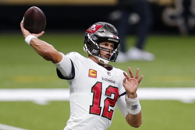 Tampa Bay Buccaneers quarterback Tom Brady (12) warms up before an NFL football game against the New Orleans Saints in New Orleans, Sunday, Sept. 13, 2020. (AP Photo/Brett Duke)