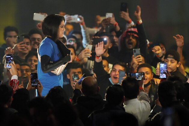SmackDown Women's Champion Bayley is greeted by fans as she enters for the second-ever women's match in Saudi Arabia at WWE Super ShowDown in Riyadh, Saudi Arabia, late Thursday, Feb. 27, 2020. (AP Photo/Amr Nabil) SmackDown Women's Champion Bayley is greeted by fans as she enters for the second-ever women's match in Saudi Arabia at WWE Super ShowDown in Riyadh, Saudi Arabia, late Thursday, Feb. 27, 2020. (AP Photo/Amr Nabil)
