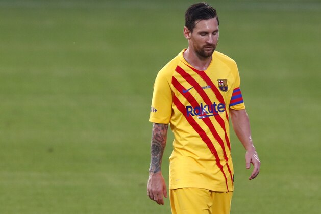 Barcelona's Lionel Messi leaves the field at half time during the pre-season friendly soccer match between Barcelona and Gimnastic at the Johan Cruyff Stadium in Barcelona, Spain, Saturday, Sept.12, 2020. (AP Photo/Joan Monfort)
