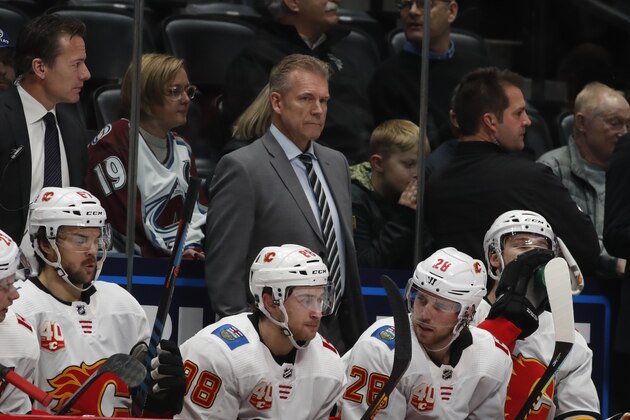 Calgary Flames interim head coach Geoff Ward in the second period of an NHL hockey game Monday, Dec. 9, 2019, in Denver. (AP Photo/David Zalubowski)