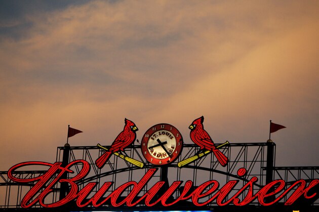 The St. Louis Cardinals birds on a bat logo is seen along with a Budweiser advertisement on a scoreboard at Busch Stadium during a baseball game between the St. Louis Cardinals and Milwaukee Brewers Tuesday, July 22, 2008, in St. Louis. (AP Photo/Jeff Roberson) The St. Louis Cardinals birds on a bat logo is seen along with a Budweiser advertisement on a scoreboard at Busch Stadium during a baseball game between the St. Louis Cardinals and Milwaukee Brewers Tuesday, July 22, 2008, in St. Louis. (AP Photo/Jeff Roberson)