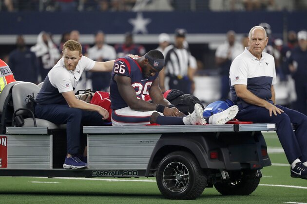 Houston Texans running back Lamar Miller, center, is driven off the field after an injury in the first half of a preseason NFL football game against the Dallas Cowboys in Arlington, Texas, Saturday, Aug. 24, 2019. (AP Photo/Roger Steinman)