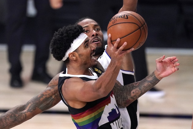 Denver Nuggets' Gary Harris, left, goes up for a shot as Los Angeles Clippers' Kawhi Leonard defends during the second half of an NBA conference semifinal playoff basketball game Sunday, Sept. 13, 2020, in Lake Buena Vista, Fla. (AP Photo/Mark J. Terrill)