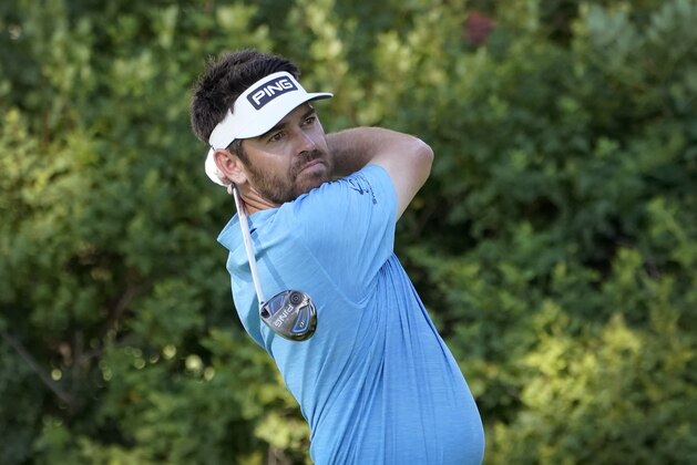 Louis Oosthuizen, of South Africa, hits from the 12th tee during the first round of the BMW Championship golf tournament, Thursday, Aug. 27, 2020, at Olympia Fields Country Club in Olympia Fields, Ill. (AP Photo/Charles Rex Arbogast) Louis Oosthuizen, of South Africa, hits from the 12th tee during the first round of the BMW Championship golf tournament, Thursday, Aug. 27, 2020, at Olympia Fields Country Club in Olympia Fields, Ill. (AP Photo/Charles Rex Arbogast)