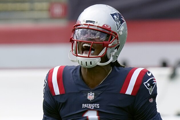 New England Patriots quarterback Cam Newton shouts as he warms up before an NFL football game against the Miami Dolphins, Sunday, Sept. 13, 2020, in Foxborough, Mass. (AP Photo/Steven Senne) New England Patriots quarterback Cam Newton shouts as he warms up before an NFL football game against the Miami Dolphins, Sunday, Sept. 13, 2020, in Foxborough, Mass. (AP Photo/Steven Senne)