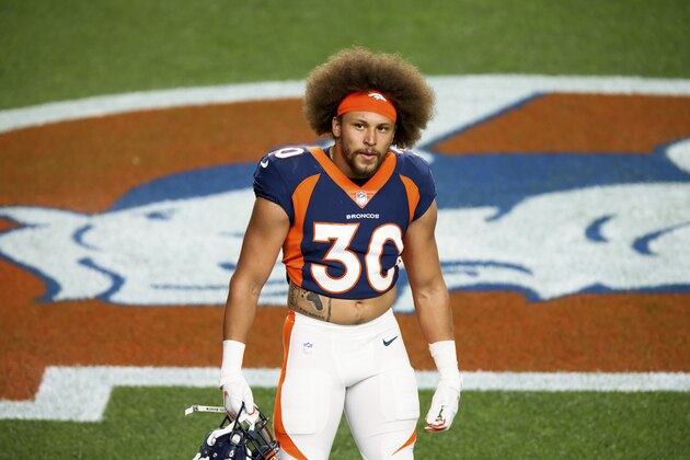 Denver Broncos running back Phillip Lindsay (30) walks on the field before taking on the Tennessee Titans in an NFL football game, Monday, Sept.. 14, 2020, in Denver. (AP Photo/Justin Edmonds)