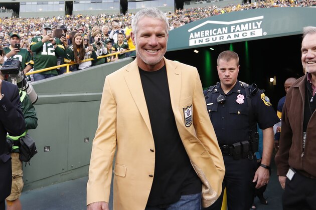 Former Green Bay Packers' Brett Favre smiles as he arrives for a halftime ceremony  of an NFL football game against the Dallas Cowboys Sunday, Oct. 16, 2016, in Green Bay, Wis. (AP Photo/Matt Ludtke)