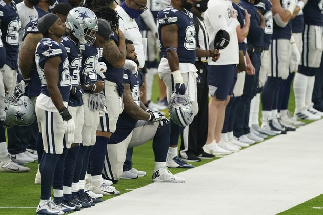 Dallas Cowboys' Dontari Poe (95) kneels during the national anthem before an NFL football game against the Los Angeles Rams Sunday, Sept. 13, 2020, in Inglewood, Calif. Poe became the first Cowboys player to ever kneel for the national anthem. (AP Photo/Ashley Landis)