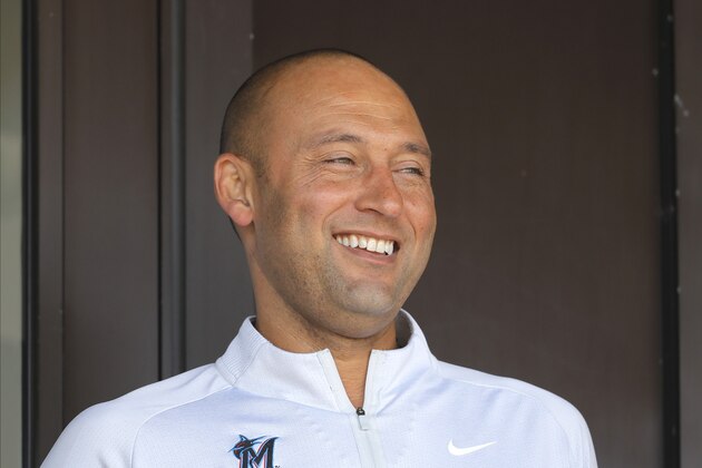 Miami Marlins CEO Derek Jeter looks on from a suite during the fourth inning of a spring training baseball game between the Washington Nationals and the Marlins, Tuesday, March 10, 2020, in Jupiter, Fla. (AP Photo/Julio Cortez)