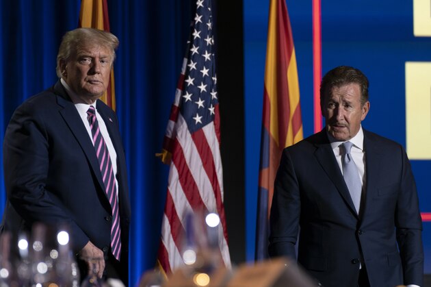 President Donald Trump speaks with Arte Moreno, owner of the Los Angeles Angels, right, at the conclusion of a Latinos for Trump Coalition roundtable at Arizona Grand Resort & Spa, Monday, Sept. 14, 2020, in Phoenix. (AP Photo/Andrew Harnik) President Donald Trump speaks with Arte Moreno, owner of the Los Angeles Angels, right, at the conclusion of a Latinos for Trump Coalition roundtable at Arizona Grand Resort & Spa, Monday, Sept. 14, 2020, in Phoenix. (AP Photo/Andrew Harnik)