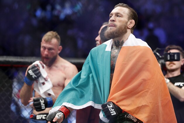 Conor McGregor celebrates after defeating Donald