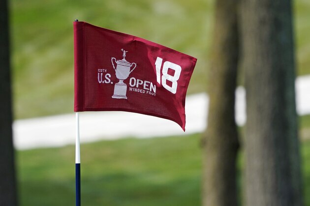 The pin flag for the 18th green flutters in the afternoon breeze during a practice round before the U.S. Open Championship golf tournament, Tuesday, Sept. 15, 2020, at the Winged Foot Golf Club in Mamaroneck, N.Y. (AP Photo/Charles Krupa) The pin flag for the 18th green flutters in the afternoon breeze during a practice round before the U.S. Open Championship golf tournament, Tuesday, Sept. 15, 2020, at the Winged Foot Golf Club in Mamaroneck, N.Y. (AP Photo/Charles Krupa)