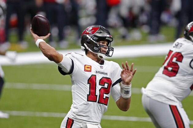 Tampa Bay Buccaneers quarterback Tom Brady (12) passes in the second half of an NFL football game against the New Orleans Saints in New Orleans, Sunday, Sept. 13, 2020. (AP Photo/Brett Duke)