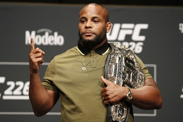 Daniel Cormier poses during a news conference for UFC 226, Thursday, July 5, 2018, in Las Vegas. Cormier is scheduled to fight Stipe Miocic in a heavyweight title fight Saturday in Las Vegas. (AP Photo/John Locher)