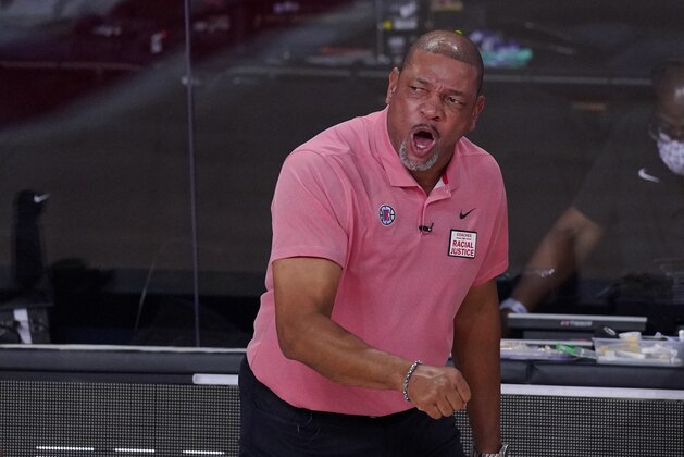 Los Angeles Clippers head coach Doc Rivers, right, complains about a call during the first half of an NBA conference semifinal playoff basketball game against the Denver Nuggets, Wednesday, Sept. 9, 2020, in Lake Buena Vista, Fla. (AP Photo/Mark J. Terrill)