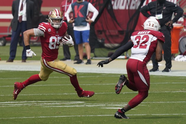 San Francisco 49ers tight end George Kittle (85) runs against Arizona Cardinals strong safety Budda Baker (32) during the first half of an NFL football game in Santa Clara, Calif., Sunday, Sept. 13, 2020. (AP Photo/Tony Avelar)