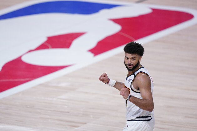 Denver Nuggets guard Jamal Murray (27) celebrates the team's win over the Los Angeles Clippers in an NBA conference semifinal playoff basketball game Tuesday, Sept. 15, 2020, in Lake Buena Vista, Fla. (AP Photo/Mark J. Terrill)
