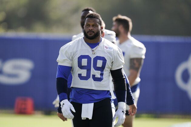 Los Angeles Rams defensive tackle Aaron Donald walks across the field during an NFL football camp practice Thursday, Aug. 27, 2020, in Thousand Oaks, Calif. (AP Photo/Jae C. Hong)
