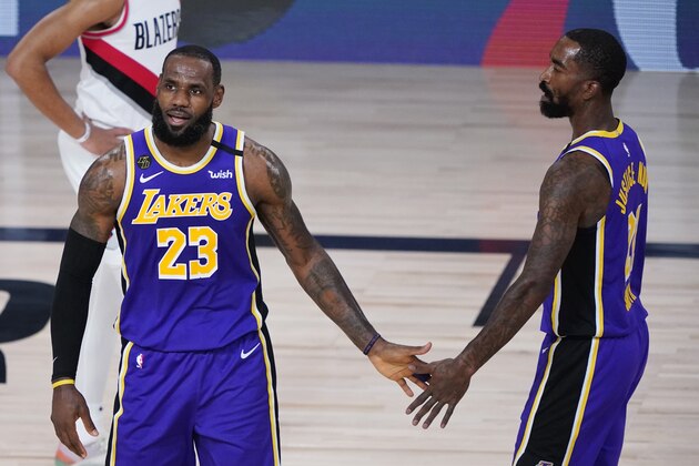 Los Angeles Lakers forward LeBron James (23) celebrates a play with teammate JR Smith (21) during the first half of an NBA basketball first round playoff game against the Portland Trail Blazers, Saturday, Aug. 22, 2020, in Lake Buena Vista, Fla. (AP Photo/Ashley Landis, Pool)