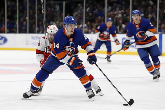 New York Islanders center Jean-Gabriel Pageau (44) controls the puck against the Carolina Hurricanes during an NHL hockey game, Saturday, March 7, 2020, in Uniondale, NY. (AP Photo/Jim McIsaac)