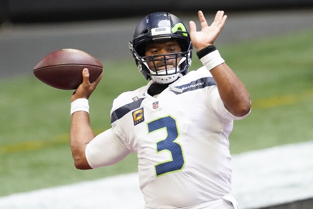 Seattle Seahawks quarterback Russell Wilson (3) warms up before the first half of an NFL football game against the Atlanta Falcons, Sunday, Sept. 13, 2020, in Atlanta. (AP Photo/John Bazemore)