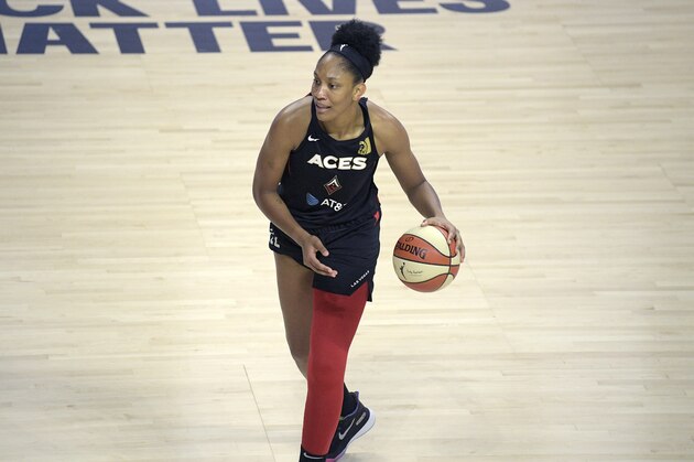 Las Vegas Aces center A'ja Wilson (22) sets up to pass the ball during the first half of a WNBA basketball game against the Washington Mystics, Saturday, Aug. 15, 2020, in Bradenton, Fla. (AP Photo/Phelan M. Ebenhack)