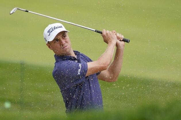 Justin Thomas, of the United States, plays a shot from a bunker on the 17th hole during the first round of the US Open Golf Championship, Thursday, Sept. 17, 2020, in Mamaroneck, N.Y. (AP Photo/Charles Krupa)