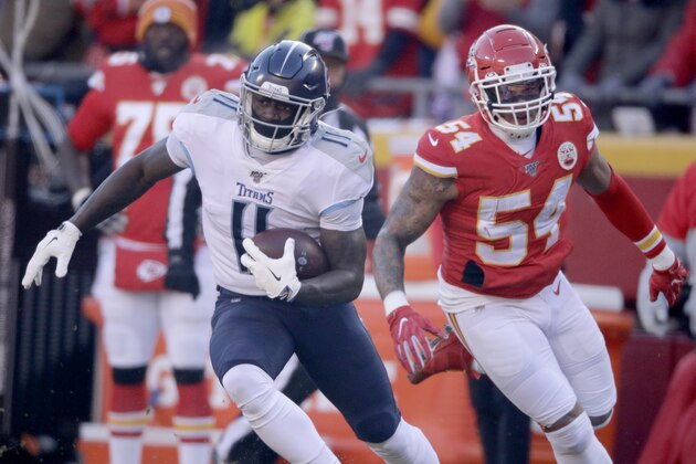Tennessee Titans' A.J. Brown (11) runs past Kansas City Chiefs' Damien Wilson (54) during the first half of the NFL AFC Championship football game Sunday, Jan. 19, 2020, in Kansas City, MO. (AP Photo/Charlie Riedel)