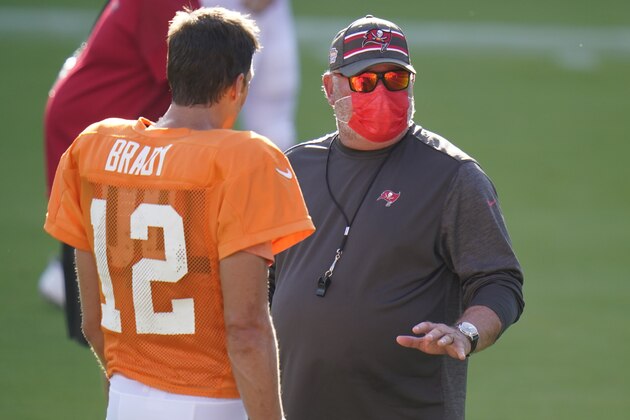 Tampa Bay Buccaneers head coach Bruce Arians talks to quarterback Tom Brady (12) during an NFL football training camp practice Friday, Aug. 28, 2020, in Tampa, Fla. (AP Photo/Chris O'Meara)