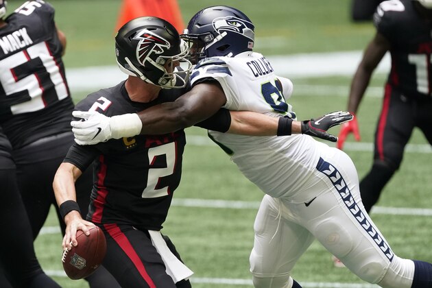 Seattle Seahawks L.J. Collier (91) hits Atlanta Falcons quarterback Matt Ryan (2) during the first half of an NFL football game, Sunday, Sept. 13, 2020, in Atlanta. (AP Photo/John Bazemore)