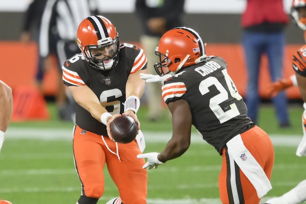 Cleveland Browns quarterback Baker Mayfield (6) hands the ball to running back Nick Chubb (24) during the first half of an NFL football game against the Cincinnati Bengals, Thursday, Sept. 17, 2020, in Cleveland. (AP Photo/David Richard)