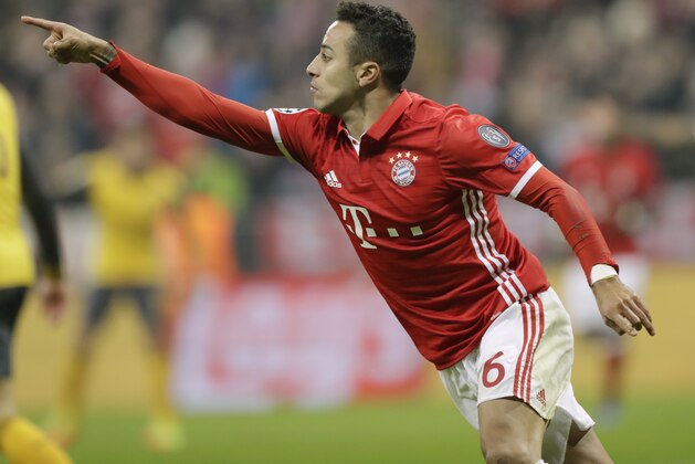 Bayern's Thiago Alcantara celebrates after scoring his side's third goal during the Champions League round of 16 first leg soccer match between FC Bayern Munich and Arsenal, in Munich, Germany, Wednesday, Feb. 15, 2017. (AP Photo/Matthias Schrader)