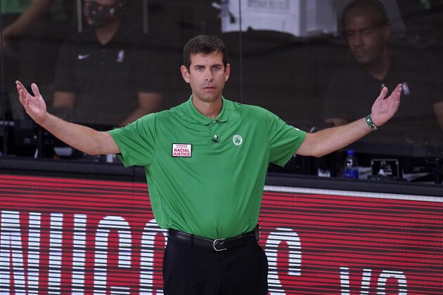 Boston Celtics head coach Brad Stevens gestures as he watches play against the Miami Heat during the second half of an NBA conference final playoff basketball game, Thursday, Sept. 17, 2020, in Lake Buena Vista, Fla. (AP Photo/Mark J. Terrill)