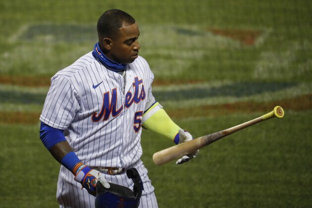 New York Mets' Yoenis Cespedes reacts after striking out against Boston Red Sox relief pitcher Marcus Walden in the sixth inning of a baseball game, Wednesday, July 29, 2020, in New York. (AP Photo/John Minchillo)