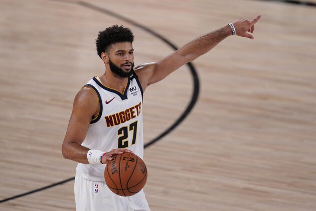 Denver Nuggets' Jamal Murray (27) gestures in the first half of an NBA conference semifinal playoff basketball game against the Los Angeles Clippers Thursday, Sept 3, 2020, in Lake Buena Vista Fla. (AP Photo/Mark J. Terrill)