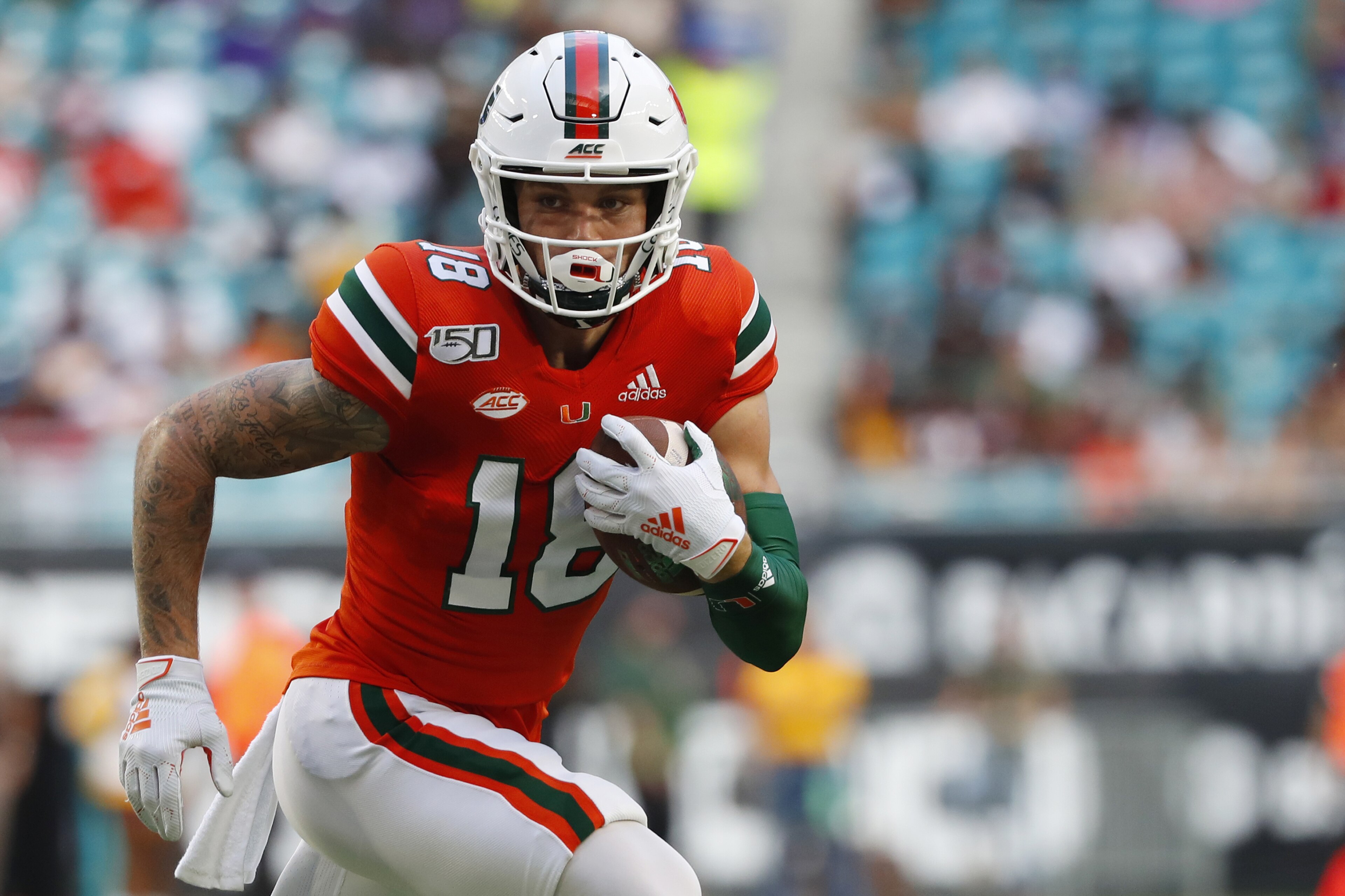 Miami quarterback Tate Martell runs for yardage during the first half of an NCAA college football game against Bethune-Cookman, Saturday, Sept. 14, 2019, in Miami Gardens, Fla. (AP Photo/Wilfredo Lee)