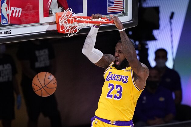 Los Angeles Lakers forward LeBron James dunks against the Denver Nuggets during the first half an NBA conference final playoff basketball game Friday, Sept. 18, 2020, in Lake Buena Vista, Fla. (AP Photo/Mark J. Terrill) Los Angeles Lakers forward LeBron James dunks against the Denver Nuggets during the first half an NBA conference final playoff basketball game Friday, Sept. 18, 2020, in Lake Buena Vista, Fla. (AP Photo/Mark J. Terrill)