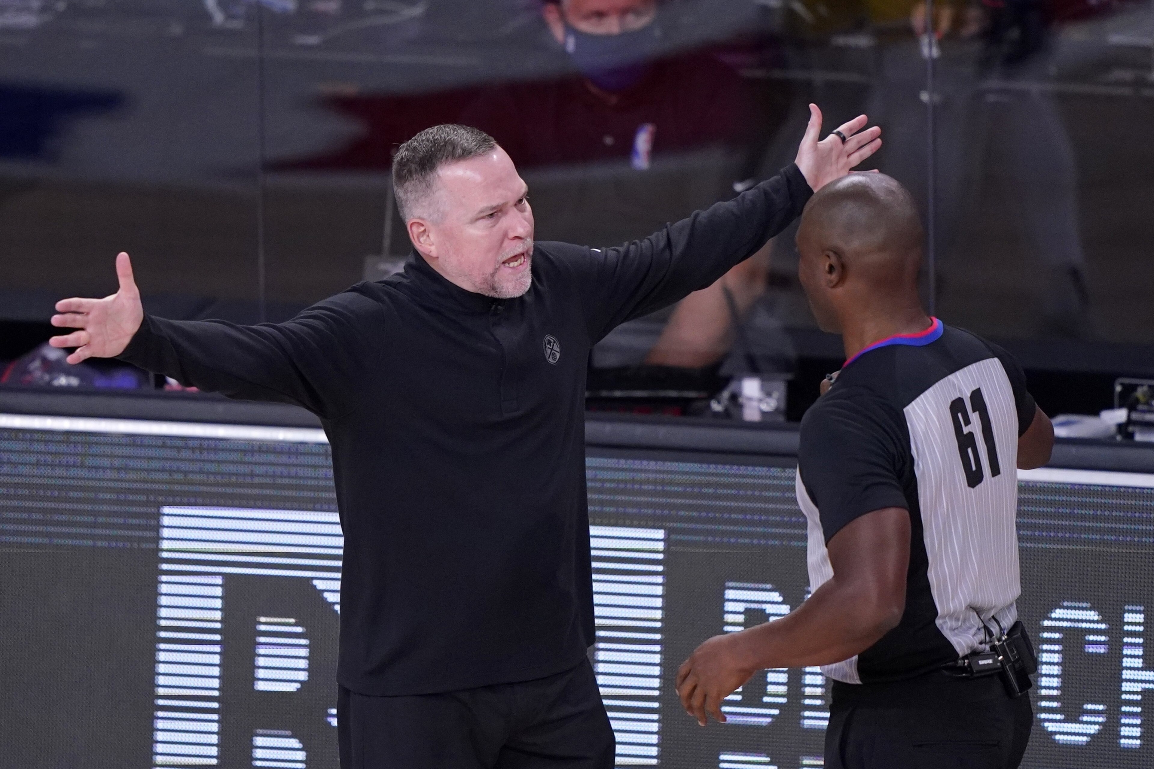 Denver Nuggets head coach Michael Malone argues with referee Courtney Kirkland (61) during the first half an NBA conference final playoff basketball game against the Los Angeles Lakers on Friday, Sept. 18, 2020, in Lake Buena Vista, Fla. (AP Photo/Mark J. Terrill)