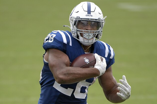 Indianapolis Colts running back Jonathan Taylor (28) rushes for yardage during the second half of an NFL football game against the Jacksonville Jaguars, Sunday, Sept. 13, 2020, in Jacksonville, Fla. (AP Photo/Phelan M. Ebenhack)