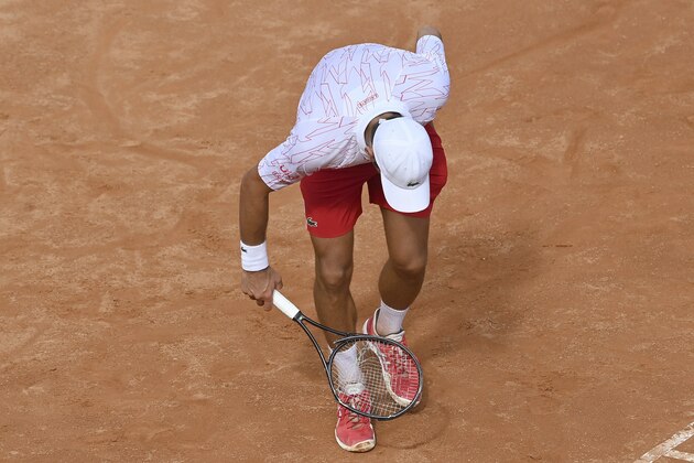 Serbia's Novak Djokovic brakes his racket during is match with Germany's Dominik Koepfer during their quarterfinals at the Italian Open tennis tournament, in Rome, Saturday, Sept. 19, 2020. (Alfredo Falcone/LaPresse via AP)